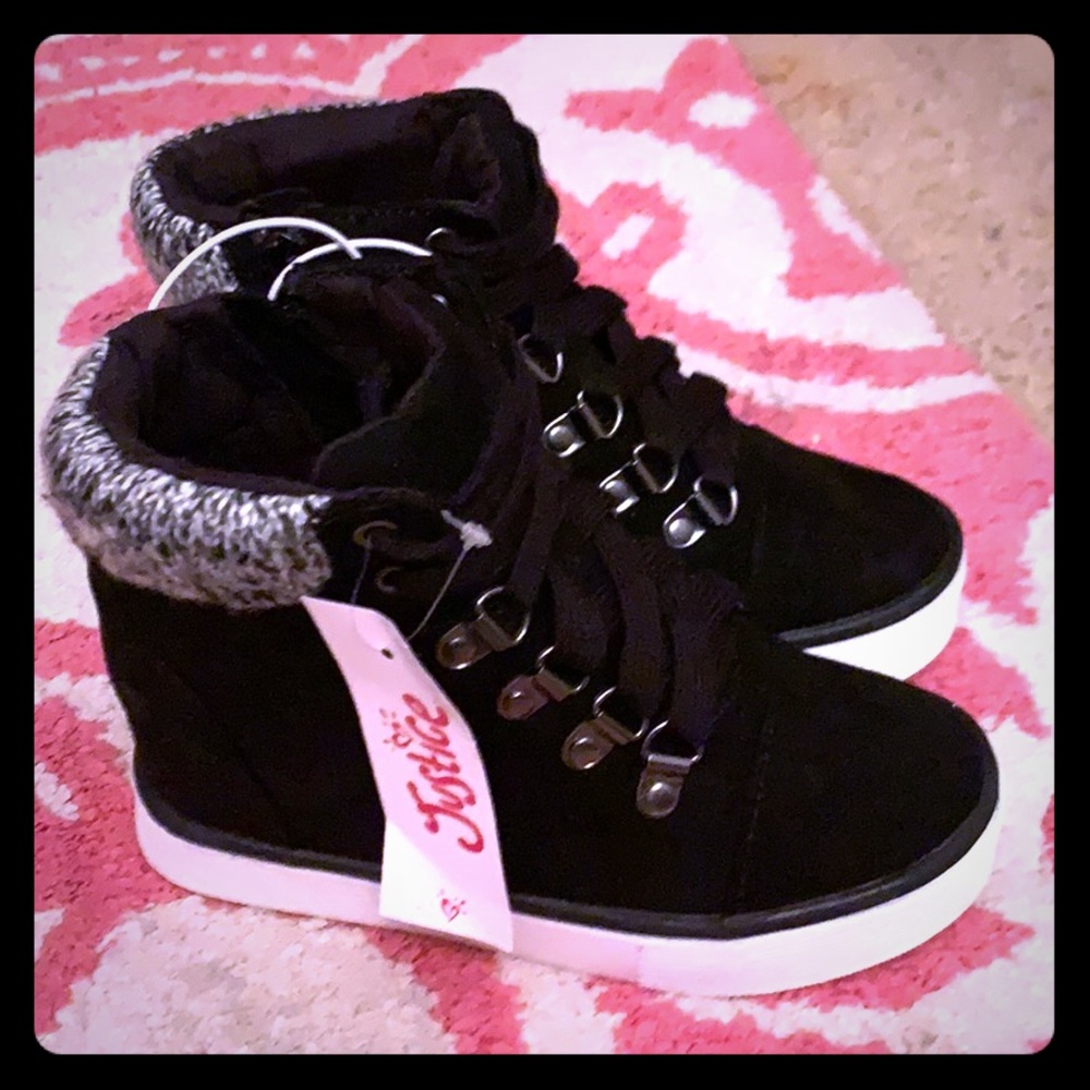 Justice black sneaker boots with heel on inside.